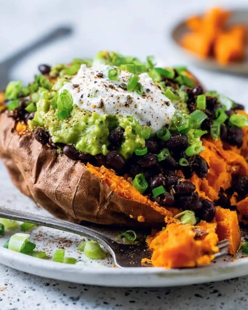 Loaded Sweet Potatoes with Avocado Coriander Crema and Black Beans Recipe