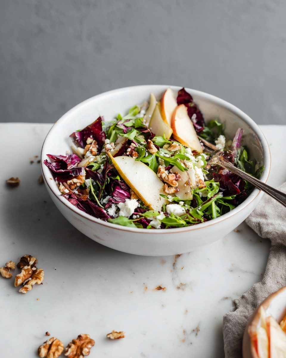 A white bowl filled with a salad showing three main layers: the bottom layer has dark red radicchio leaves mixed with light green watercress, the middle layer features pale slices of pear with brown skin, and the top layer includes small pieces of white cheese and walnut chunks scattered around. A silver fork rests inside the bowl on the left side, and a few walnut pieces are scattered on the white marbled surface around the bowl. The background is simple and grey, giving focus to the fresh salad. Photo taken with an iphone --ar 4:5 --v 7