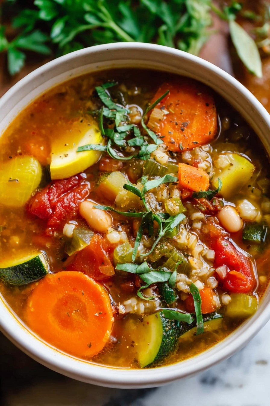 The image shows a close-up of a large silver spoon filled with a colorful stew. The stew has three main layers visible on the spoon: a layer of light green and dark green zucchini slices, a layer of round, bright orange carrot slices, and a layer of small, brown ground meat pieces mixed with white beans and diced red tomatoes. The stew is in a bowl with a white marbled surface background, and the broth appears slightly thick with a yellowish color and some herbs floating in it. photo taken with an iphone --ar 2:3 --v 7 - Turkey Vegetable Soup, healthy turkey soup, easy vegetable soup, hearty turkey soup, nutritious turkey vegetable bowl
