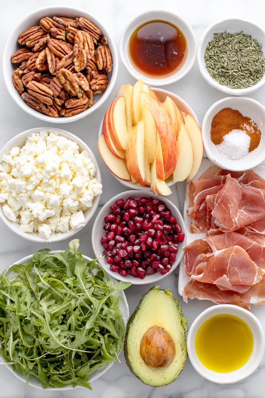 Flat lay of raw pecans, pumpkin seeds, small white bowl of maple syrup, small white bowl of cayenne pepper, small white bowl of ground cinnamon, flaky sea salt sprinkled in a small white dish, thinly sliced prosciutto laid neatly, fresh arugula leaves, thinly sliced honeycrisp apples arranged in a fan, diced ripe avocado, bright red pomegranate arils, crumbled feta cheese piled in a small white bowl, small white bowls of extra virgin olive oil, apple cider vinegar, Dijon mustard, apple butter, honey, fresh thyme leaves, chopped fresh sage, kosher salt and black pepper in small white bowls, all ingredients fresh and natural, balanced symmetrical layout placed on a clean white marble surface, soft natural light, photo taken with an iPhone, professional food photography style, fresh ingredients, white ceramic bowls, no bottles, no duplicates, no utensils, no packaging --ar 2:3 --v 7 --p awthu7i m7354615311229779997 - Autumn Harvest Honeycrisp Apple and Feta Salad, fall apple salads, honeycrisp apple recipes, healthy apple salad, seasonal fall salads