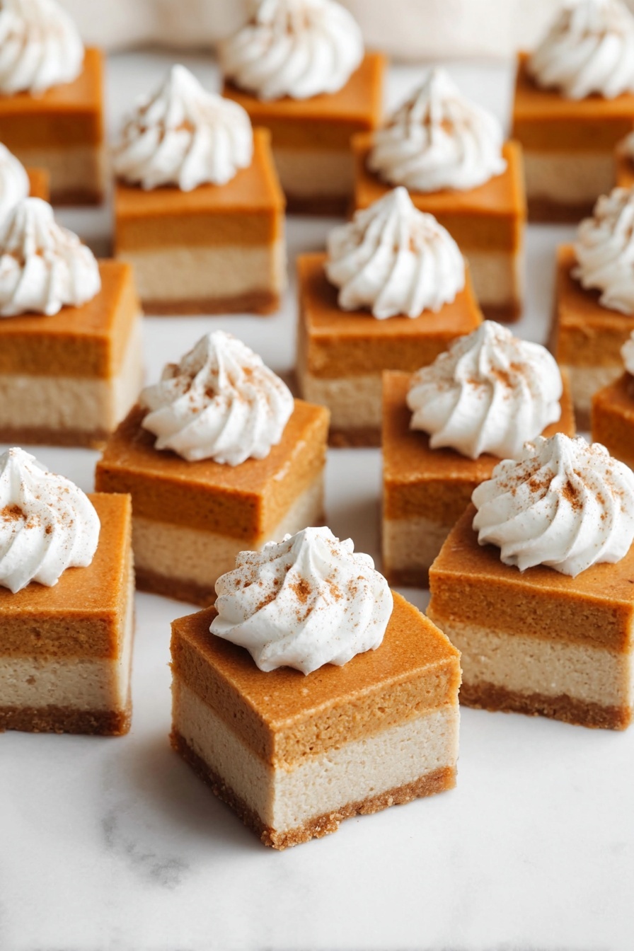 The image shows many small square dessert bars arranged on a white marbled surface. Each bar has two layers: a lighter beige bottom layer that looks firm, and a thicker top layer of smooth, orange-brown color. On top of each bar is a swirl of white whipped cream with a small sprinkle of brown spice, centered on the orange layer. The bars are evenly spaced and appear soft and moist. Photo taken with an iphone --ar 2:3 --v 7 - Pumpkin Pie Bars, pumpkin dessert, fall dessert recipes, easy pumpkin bars, Spiced Pumpkin Bars