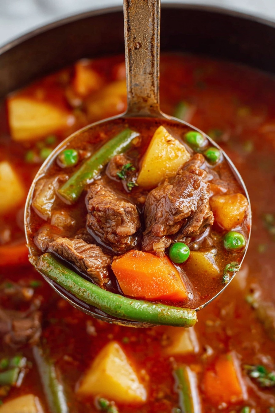 A close-up view of a ladle lifting a rich beef stew filled with soft brown chunks of beef, bright orange carrot pieces, yellow potato cubes, green beans, and green peas all mixed in a thick, deep reddish-brown broth. The background shows more of the stew with similar colorful vegetables and beef pieces visible. The ladle handle stands upright, emphasizing the hearty ingredients and texture of the dish. The scene is set on a white marbled surface. Photo taken with an iphone --ar 2:3 --v 7 - Vegetable Beef Stew, hearty beef stew, easy beef stew recipe, flavorful beef and vegetable stew, comforting beef stew