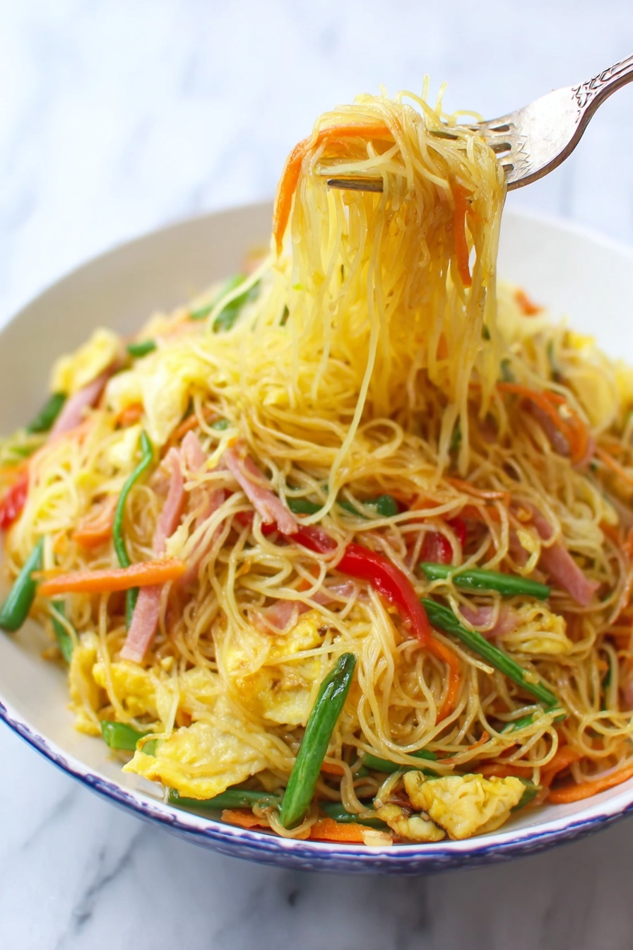 A white bowl filled with thin yellow noodles mixed with bright orange carrot strips, light green beans, red bell pepper slices, and small pieces of scrambled egg, all stirred together with thin strips of ham that have a light pink color. A fork lifts a bundle of noodles from the bowl, showing the textured and slightly oily surface of the noodles. The background is a white marbled surface. photo taken with an iphone --ar 2:3 --v 7 - Singapore Rice Noodles with Shrimp and Curry, flavorful Asian noodle dish, easy shrimp stir-fry recipe, quick Thai-style rice noodles, vibrant seafood noodle dish