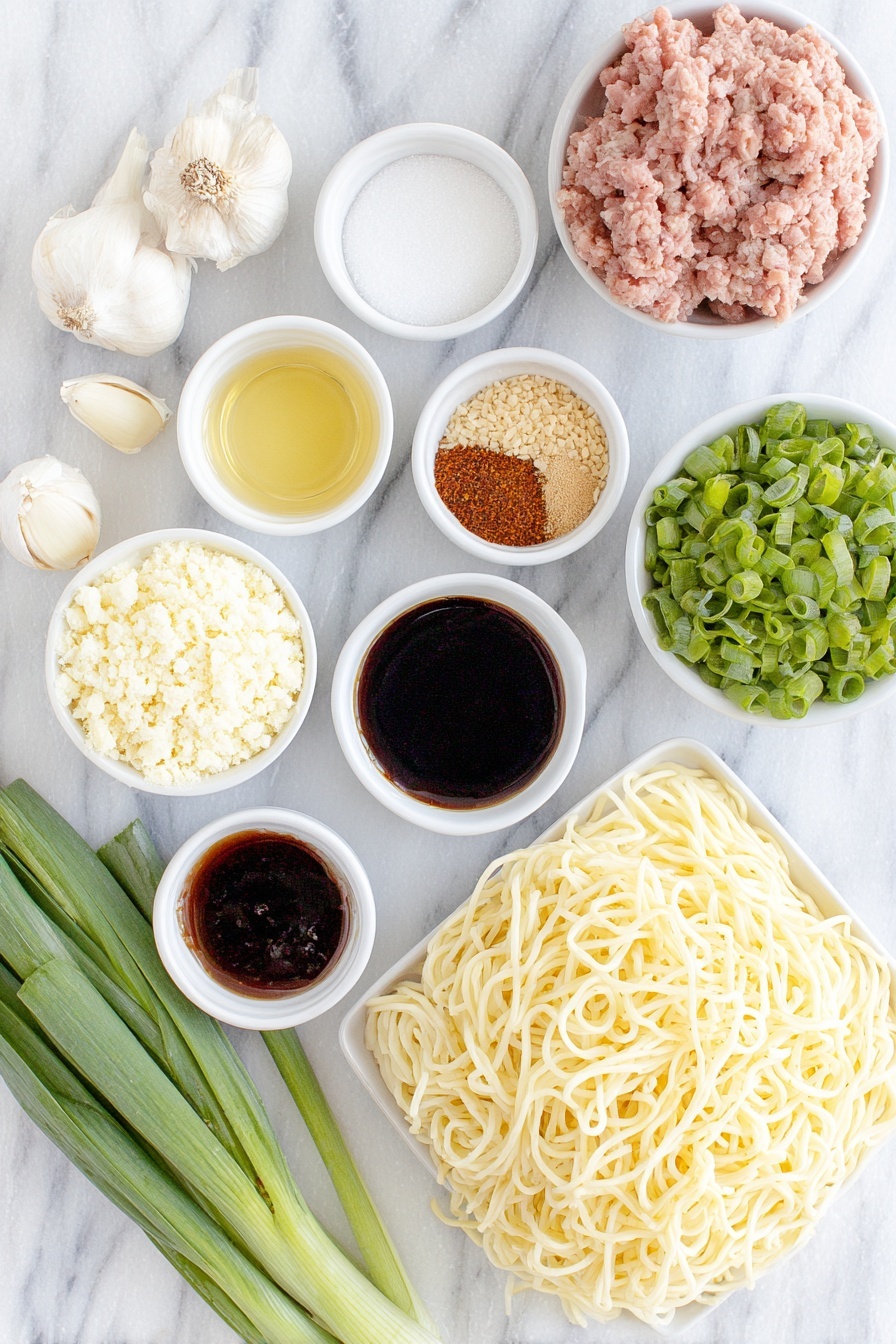 Flat lay of a small mound of thick, creamy Chinese sesame paste, a small white bowl of bright red chili paste in oil, a small white bowl of dark light soy sauce, two whole uncracked garlic cloves, a small white bowl of white granulated sugar, a small white bowl of earthy brown Chinese five spice powder, a small white bowl of finely ground reddish Sichuan pepper powder, a small white bowl of vibrant red chili oil, a small white bowl of golden chicken broth, a small white bowl of glossy dark hoisin sauce, a small white bowl of thick dark soy sauce, a small white bowl of pale golden Chinese cooking wine, a small white bowl of clear vegetable oil, a small portion of raw pink pork mince, a small pile of finely chopped deep green preserved mustard greens, a neat pile of fresh white medium-thickness wheat noodles (about 3mm thick), a bunch of fresh green choy sum stems cut into 15 cm sections, two whole green onions sliced thinly, and a small heap of coarsely chopped light brown peanuts, all arranged in perfect symmetry on simple white ceramic bowls and plates, placed on a clean white marble surface, soft natural light, photo taken with an iPhone, professional food photography style, fresh ingredients, white ceramic bowls, no bottles, no duplicates, no utensils, no packaging --ar 2:3 --v 7 --p m7354615311229779997 - Spicy Dan Dan Noodles with Pork, Sichuan Dan Dan Noodles, Easy Spicy Pork Noodles, Authentic Dan Dan Noodles Recipe, Savory Pork Noodle Bowl