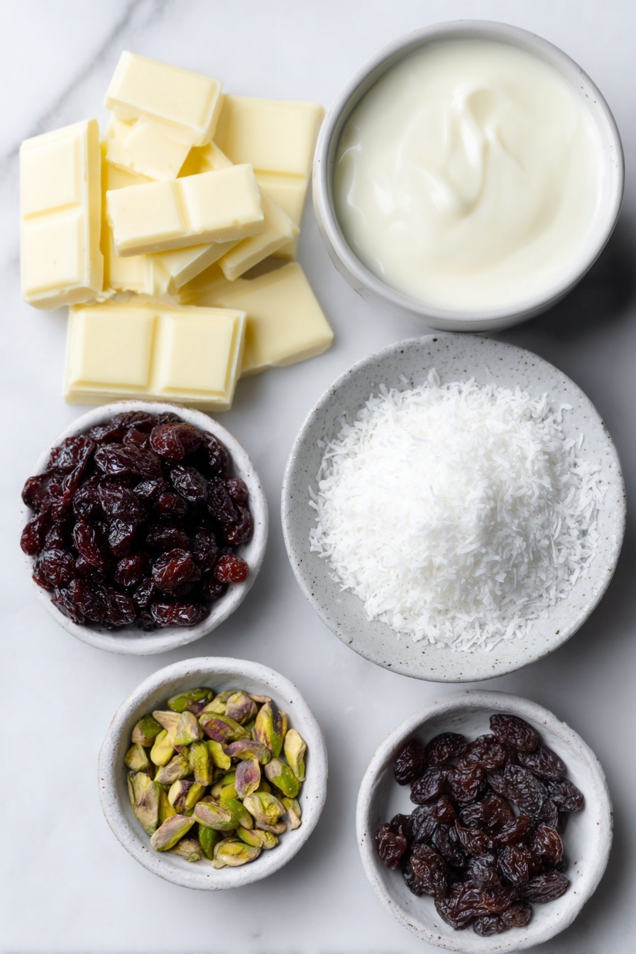 Flat lay of a small pile of chopped white chocolate pieces, a small white ceramic bowl filled with thickened cream, a tiny white bowl holding glossy vanilla bean paste, a small white bowl containing chopped dried cranberries, a small white bowl with chopped pistachios, and a shallow white ceramic dish with fine desiccated coconut arranged neatly beside them, all ingredients fresh and natural, placed on a clean white marble surface, soft natural light, photo taken with an iPhone, professional food photography style, fresh ingredients, white ceramic bowls, no bottles, no duplicates, no utensils, no packaging --ar 2:3 --v 7 --p m7354615311229779997 - White Chocolate Cranberry Pistachio Truffles, holiday truffles, no-bake holiday treats, easy festive desserts, Christmas chocolate candies