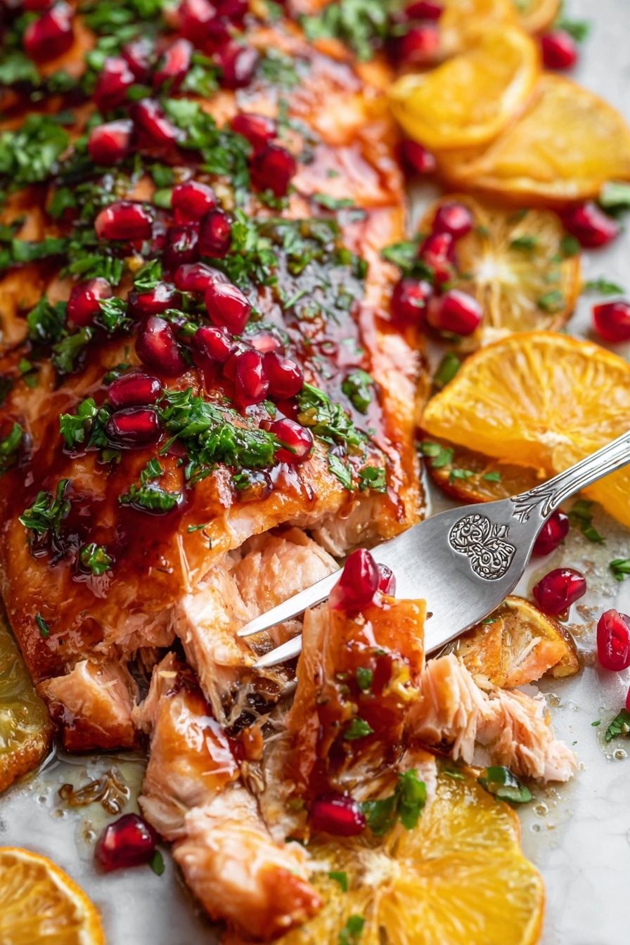 The image shows a close-up of a cooked salmon fillet with a shiny, reddish-brown glaze. On top of the salmon, there are small green herb pieces, bright red pomegranate seeds, and orange slices cut into wedges. The salmon is flaking apart slightly where a silver fork with floral designs holds a piece of the fish. All the elements are arranged over a white marbled surface. The colors are rich and vibrant, with the orange slices and pomegranate seeds standing out against the green herbs and the warm, cooked salmon. Photo taken with an iphone --ar 2:3 --v 7 - Pomegranate Orange Glazed Salmon, healthy salmon recipes, easy seafood dinner ideas, citrus glazed fish, elegant salmon dishes