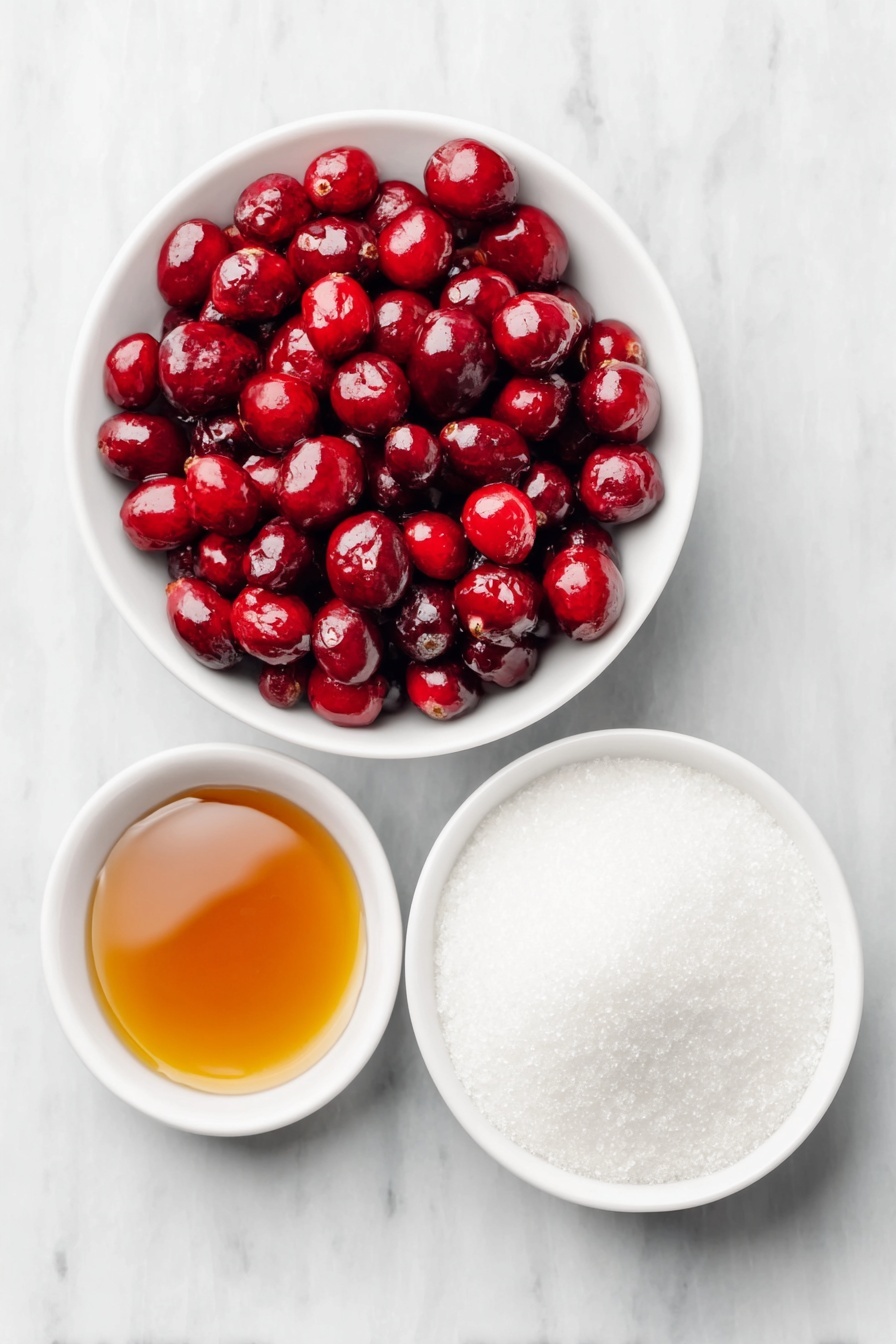 Flat lay of a small white ceramic bowl filled with glossy pure maple syrup, a medium white ceramic bowl of vibrant fresh red cranberries, a larger white ceramic bowl heaped with fine white granulated sugar, arranged with perfect symmetry and balanced proportions, all ingredients looking fresh and natural, placed on a clean white marble surface, soft natural light, photo taken with an iPhone, professional food photography style, fresh ingredients, white ceramic bowls, no bottles, no duplicates, no utensils, no packaging --ar 2:3 --v 7 --p m7354615311229779997 - Sparkling Cranberries, holiday cranberry treats, festive Xmas snacks, sparkling berry garnishes, easy holiday finger foods