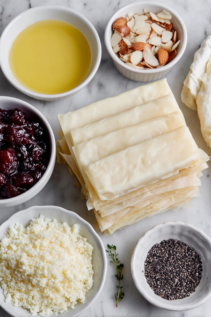 Flat lay of six sheets of thin, delicate frozen filo pastry thawed and stacked neatly, a small white bowl of golden melted butter, several long slices of creamy brie cheese arranged in a simple row, a small white bowl filled with vibrant red cranberry sauce, a small white bowl holding pale beige flaked almonds, a small white bowl with tiny black sesame seeds scattered inside — all placed on a clean white marble surface, soft natural light, photo taken with an iPhone, professional food photography style, fresh ingredients, white ceramic bowls, no bottles, no duplicates, no utensils, no packaging --ar 2:3 --v 7 --p m7354615311229779997 - Cranberry Brie Filo Crackers, holiday appetizer ideas, quick party snacks, elegant finger foods, cranberry brie appetizer