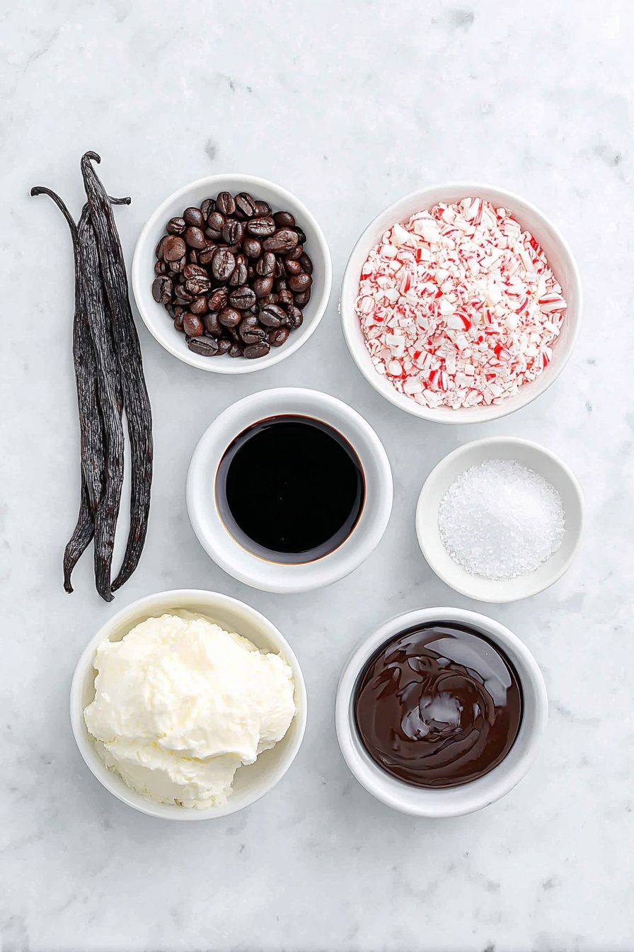 Flat lay of fresh whole vanilla bean pod, two glossy dark roasted espresso beans, a small white ceramic bowl of rich black espresso, a small white ceramic bowl with creamy half & half, a small white ceramic bowl of smooth dark coffee liqueur, a small white ceramic bowl of clear peppermint extract, a small white ceramic bowl filled with crushed red and white candy cane pieces, and a small white ceramic bowl of glossy chocolate syrup, all arranged in perfect symmetry, placed on a clean white marble surface, soft natural light, photo taken with an iPhone, professional food photography style, fresh ingredients, white ceramic bowls, no bottles, no duplicates, no utensils, no packaging --ar 2:3 --v 7 --p m7354615311229779997 - Peppermint Espresso Martini, festive cocktail recipes, holiday drinks, peppermint martini, espresso martini with peppermint
