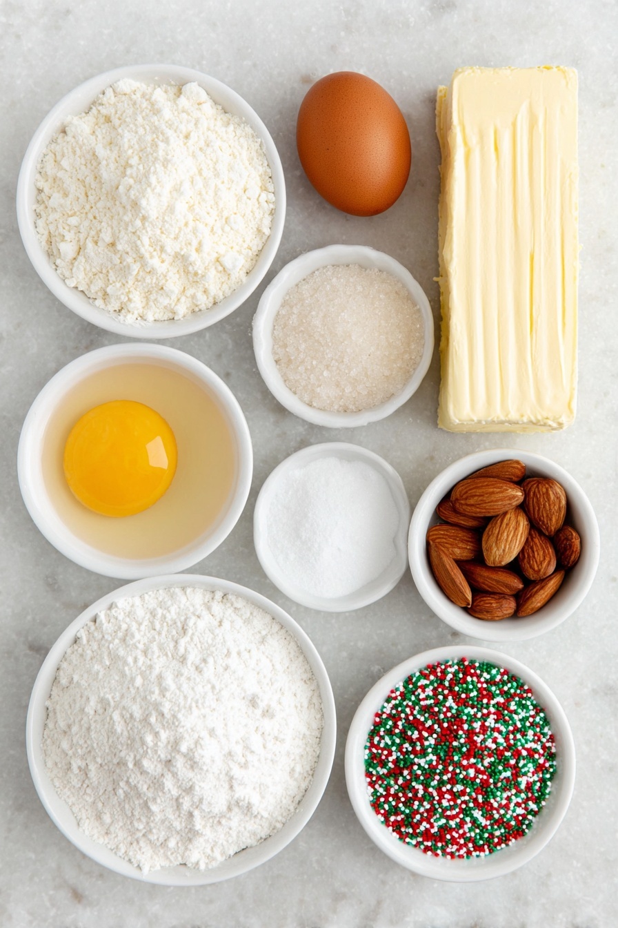 Flat lay of a stick of unsalted butter, a small heap of granulated sugar, one whole brown egg, a few almonds next to a small white bowl of clear almond extract, a small white bowl of pale vanilla extract, a mound of all-purpose flour, a small white bowl containing white cornstarch powder, a small white bowl filled with baking powder, a small white bowl of fine salt, a small white bowl filled with festive red and green nonpareil sprinkles, and three rectangles of cookie dough colored natural white, bright red, and vibrant green, all arranged in perfect symmetry on a clean white marble surface, soft natural light, photo taken with an iPhone, professional food photography style, fresh ingredients, white ceramic bowls, no bottles, no duplicates, no utensils, no packaging --ar 2:3 --v 7 --p m7354615311229779997 - Colorful Swirled Christmas Cookies, festive holiday cookies, easy Christmas cookie recipes, colorful holiday cookies, swirl cookie ideas