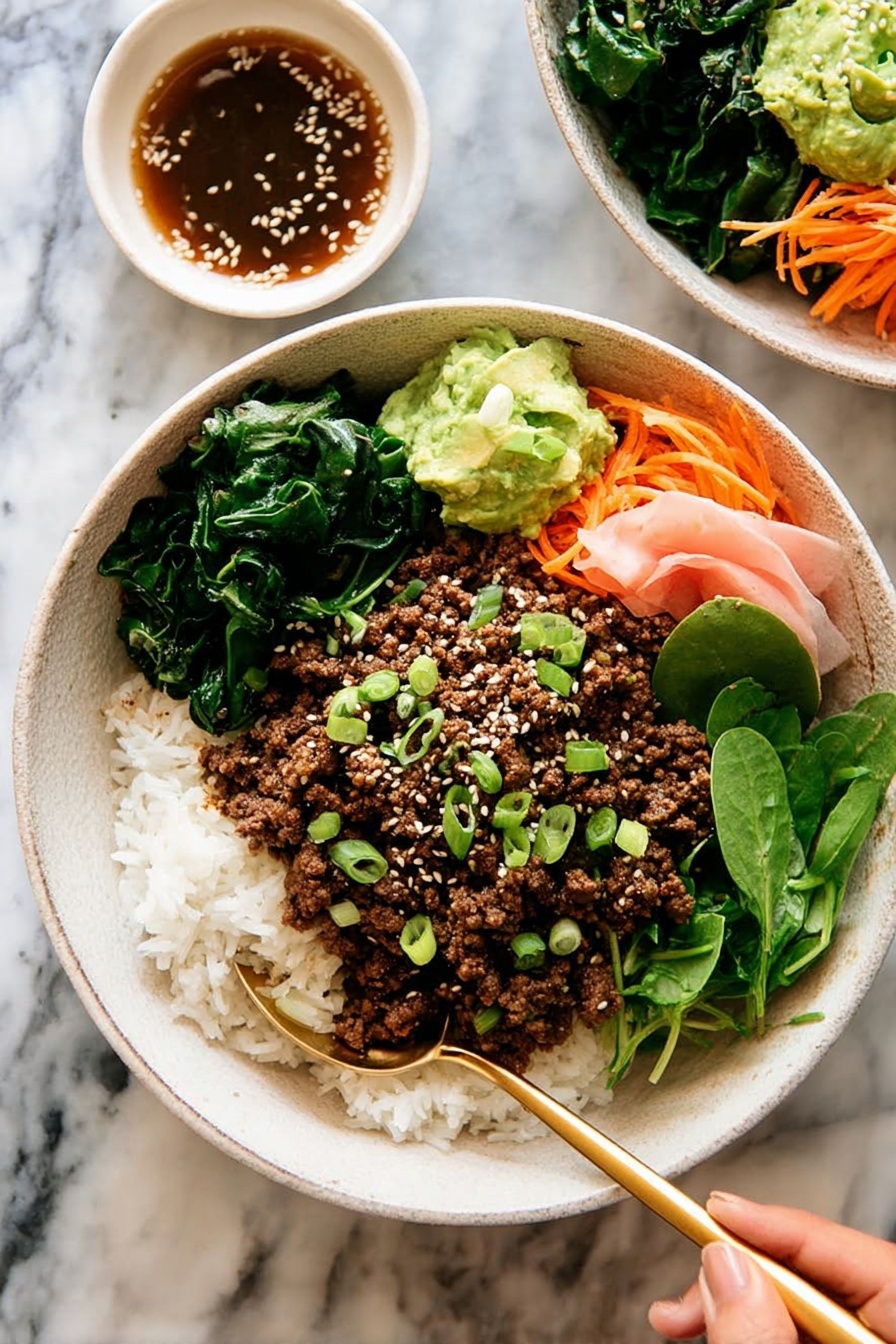 The dish is served in a white bowl filled with three main layers: at the bottom is a bed of white rice mixed with small green vegetables and thin orange carrot strips, on top is a layer of crumbly cooked brown ground meat, and on one side there are fresh green leafy lettuce and soft pink pickled ginger slices. In the center of the bowl, a small dollop of green mashed avocado is sprinkled with white sesame seeds and chopped green onions. A gold spoon rests inside the bowl against the edge, and the bowl sits on a white marbled surface next to a white cloth napkin. Photo taken with an iphone --ar 2:3 --v 7 - Korean Beef Bulgogi Rice Bowls, Korean beef bulgogi, bulgogi rice bowl recipe, easy Korean beef dishes, quick Asian rice bowls