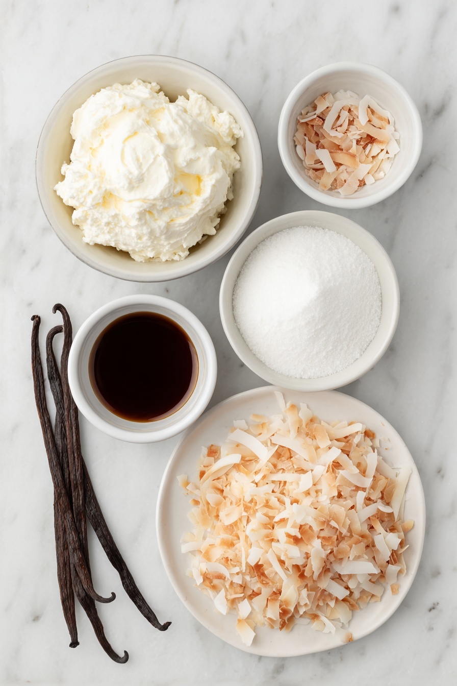 Flat lay of a small mound of cold heavy cream in a simple white ceramic bowl, a small white bowl filled with fine powdered sugar, a few whole brown vanilla beans beside a tiny white bowl holding vanilla extract, a larger white bowl containing cold full-fat coconut milk, a small white bowl with cold sweetened condensed milk, a tiny white bowl with coconut extract, and a neat pile of toasted unsweetened shredded coconut flakes on a white ceramic plate, all arranged symmetrically and naturally with fresh, unprocessed appearance placed on a clean white marble surface, soft natural light, photo taken with an iPhone, professional food photography style, fresh ingredients, white ceramic bowls, no bottles, no duplicates, no utensils, no packaging --ar 2:3 --v 7 --p m7354615311229779997 - Homemade Coconut Ice Cream, Coconut Ice Cream, Tropical Coconut Dessert, No-Churn Coconut Ice Cream, Dairy-Free Coconut Ice Cream