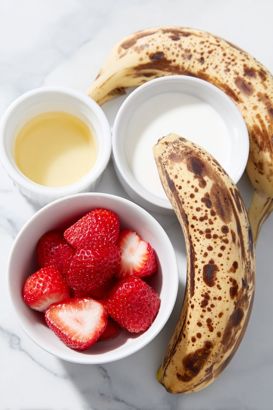 Flat lay of peeled ripe bananas with brown spots, bright red frozen strawberries, a small white ceramic bowl of pale vanilla extract, a small white ceramic bowl of creamy non-dairy milk, placed on a clean white marble surface, soft natural light, photo taken with an iPhone, professional food photography style, fresh ingredients, white ceramic bowls, no bottles, no duplicates, no utensils, no packaging --ar 2:3 --v 7 --p m7354615311229779997 - Healthy Strawberry Banana Smoothie Bowl, healthy breakfast recipes, easy smoothie bowl, nutritious fruit bowls, quick healthy snacks